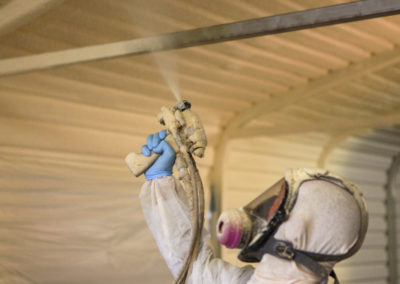 Spraying a Metal Building